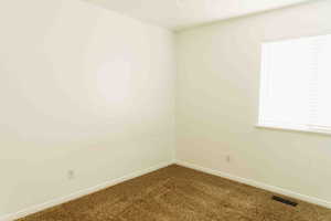 Bedroom 3 with carpet and baseboards