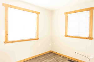 Spare/extra room featuring LVP wood finished floors and baseboards
