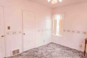 Bedroom with carpet and baseboards