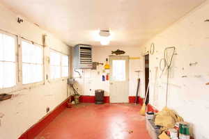 Garage/workshop w/ plenty of natural light and a heating unit