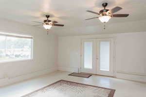 Bonus room with french doors and ceiling fans