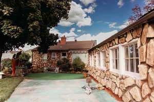 View of patio, garage & back of home