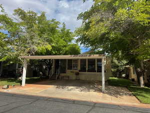 Manufactured / mobile home featuring a sunroom and a patio