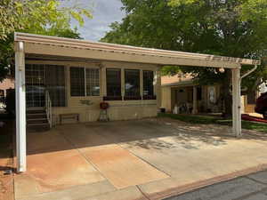 View of front of home with a patio