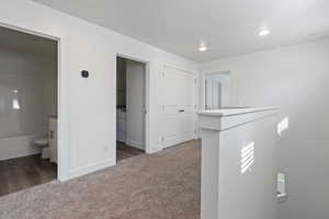 Hallway featuring carpet floors, recessed lighting, and washer / clothes dryer