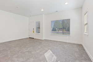 Unfurnished room featuring recessed lighting