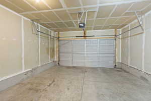Garage featuring a garage door opener