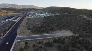 Aerial view of property's location featuring a mountain backdrop