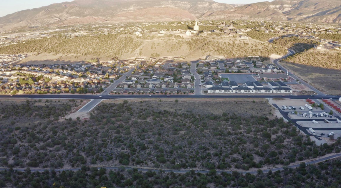 Aerial perspective of suburban area featuring a mountainous background