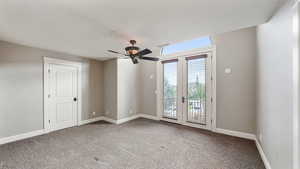 Empty room featuring light carpet and ceiling fan