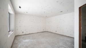 Spare room with concrete floors