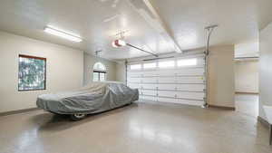 Garage featuring baseboards