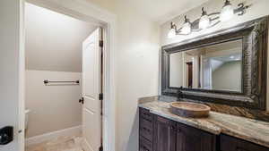 Bathroom featuring vanity and light tile patterned floors