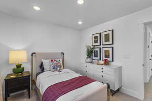 Bedroom featuring light colored carpet and recessed lighting