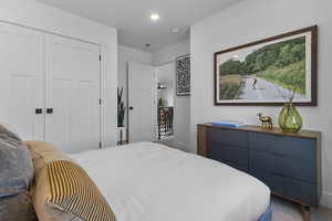 Carpeted bedroom featuring a closet and recessed lighting
