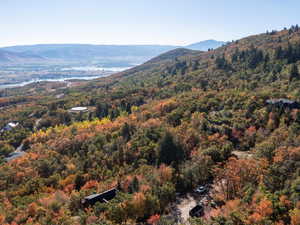 Mountain view featuring a large body of water and a forest