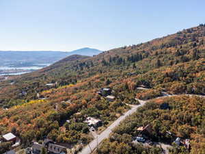 Bird's eye view of a water and mountain view and a heavily wooded area