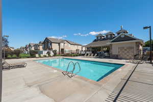 Community pool with a patio area.