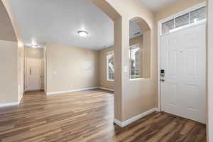 Living Room facing Entry to Garage, Laundry and 1/2 bath.