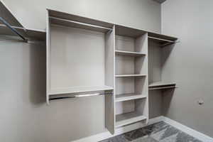 Walk in closet featuring carpet flooring