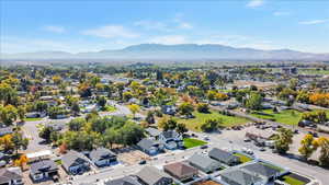 Aerial perspective of suburban area featuring a mountain backdrop