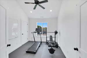 Exercise room with recessed lighting, ceiling fan, and lofted ceiling