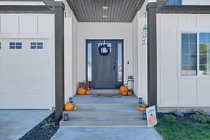 Doorway to property with board and batten siding