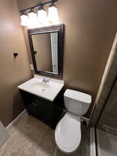 Bathroom with vanity and a shower stall