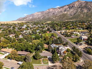 Aerial perspective of suburban area featuring a mountainous background