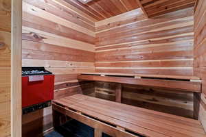 Relaxing sauna / steam room with wooden ceiling and wooden walls