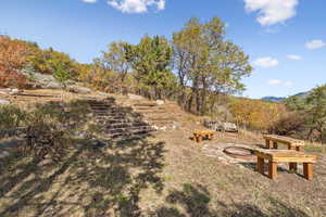 View of yard with an outdoor fire pit
