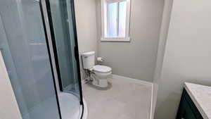 Full bath featuring vanity and a stall shower