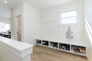 Mudroom featuring light wood-type flooring and recessed lighting