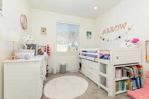 Bedroom featuring light carpet and recessed lighting