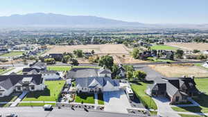 Aerial view of residential area featuring a mountainous background