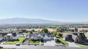 Aerial view of residential area featuring a mountain backdrop