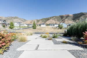 View of mountain backdrop featuring nearby suburban area