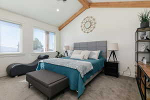 Carpeted bedroom featuring a ceiling fan and recessed lighting