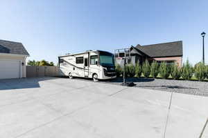 View of car parking featuring a gate