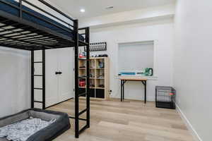 Bedroom featuring light wood finished floors and recessed lighting