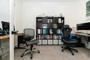 Office area with carpet flooring