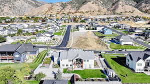 Aerial perspective of suburban area with a mountainous background