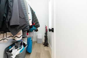 Spacious closet featuring light wood-type flooring