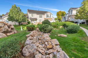 View of grassy yard with a residential view