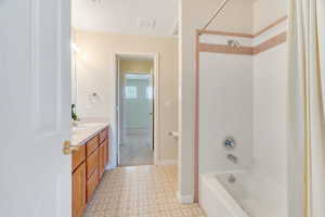 Bathroom featuring shower / bathtub combination and vanity