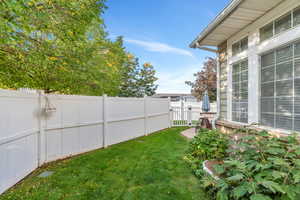 View of fenced backyard