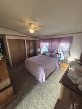 Bedroom with two closets and ceiling fan