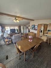 Dining area with carpet and a ceiling fan
