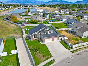 Aerial perspective of suburban area featuring a water and mountain view