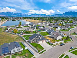Aerial perspective of suburban area featuring a water and mountain view